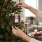 Mellow Monkey Cheery Mrs. Claus blown glass holiday ornament, holding gingerbread cookies. 4.25-in.