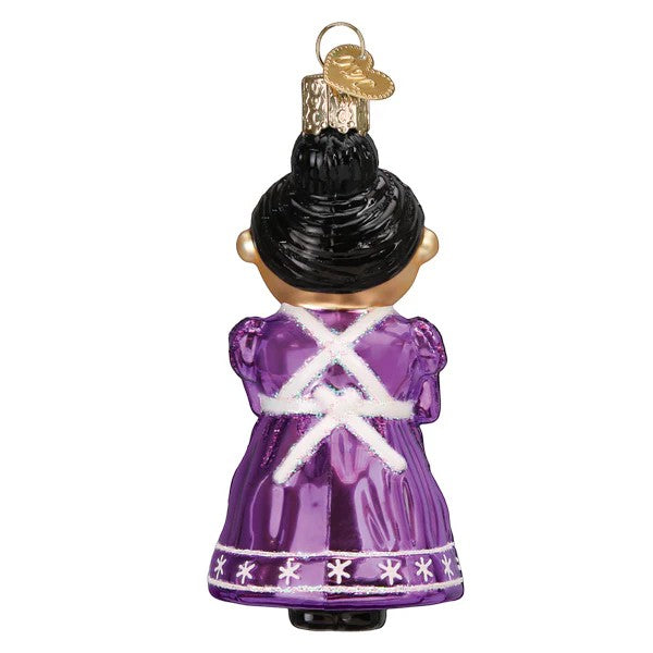 Mellow Monkey Cheery Mrs. Claus blown glass holiday ornament, purple dress with white apron detail and snowflake trim.