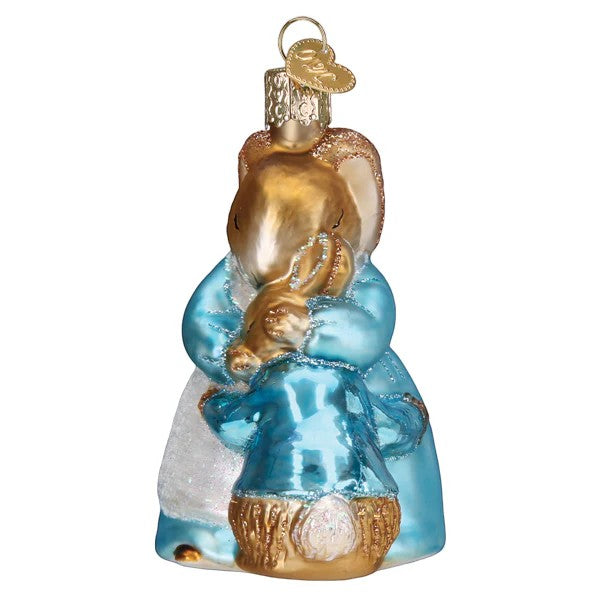 Mellow Monkey Mrs. Rabbit and Peter blown glass holiday ornament, 3-3/4-in. Features Mrs. Rabbit in a blue dress holding Peter Rabbit.