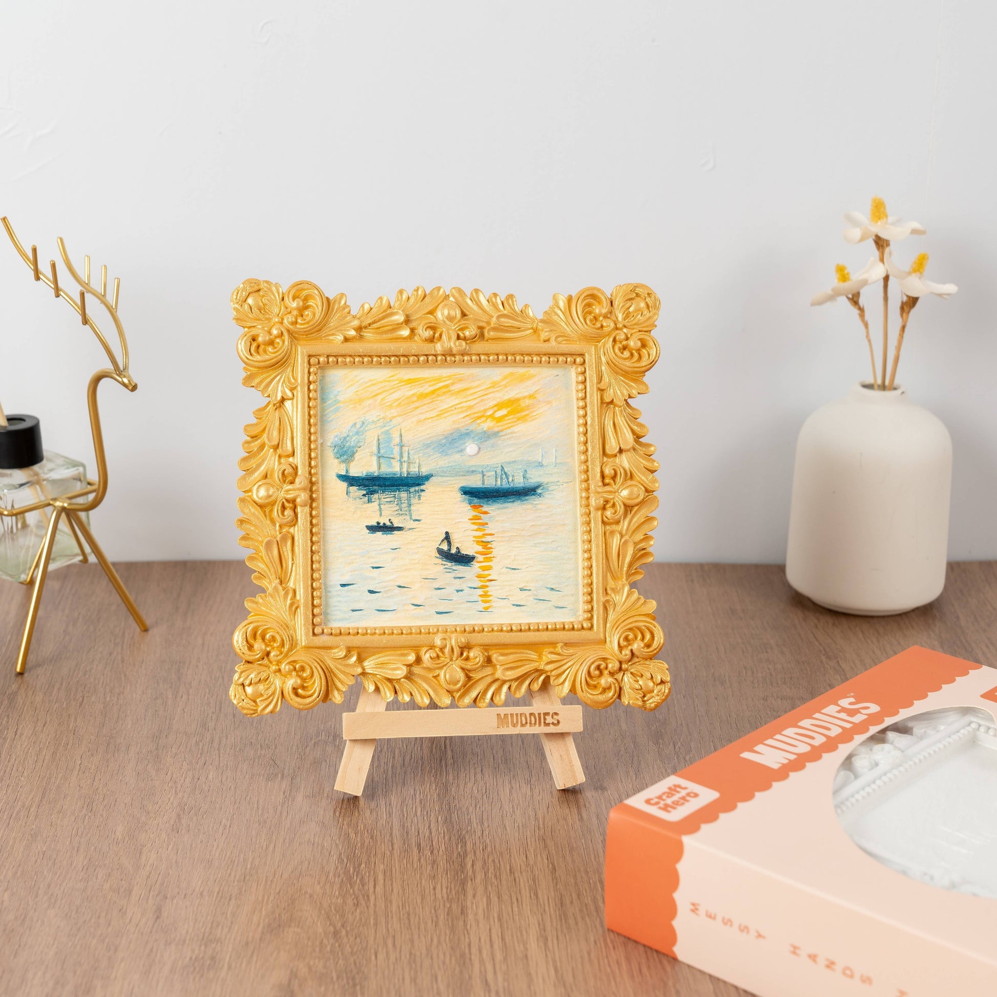 Mellow Monkey Muddies 3D wall frame painting kit featuring a textured Impressionist sunrise scene in a gold frame.