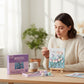 Mellow Monkey Muddies 3D textured tulip canvas painting kit being crafted by a woman at a wooden table.