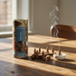Mellow Monkey mulled wine scented incense cones with ceramic holder and decorative packaging on a wooden table