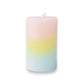 Mellow Monkey multi-scented pillar candle featuring a pink, yellow, and blue ombre wax design with a cotton wick.