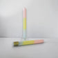 Mellow Monkey multi-scented square taper candle in pink, yellow, and blue ombre paraffin wax with a cotton wick.