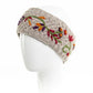 Mellow Monkey Naomi light natural wool headband with colorful floral embroidery and soft fleece lining on a mannequin