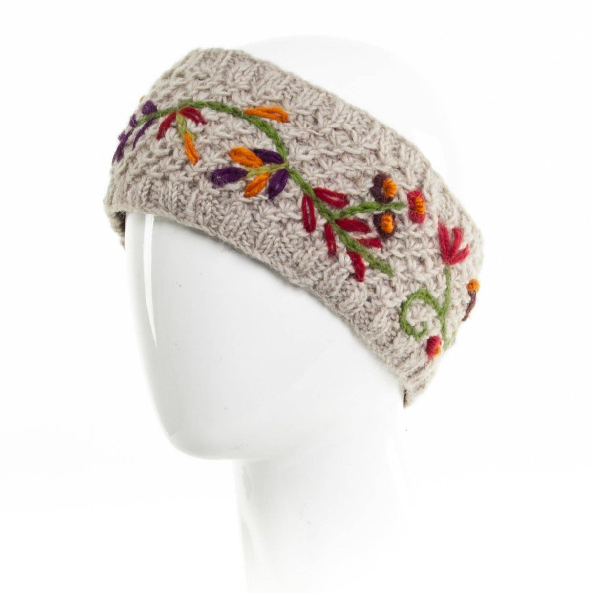 Mellow Monkey Naomi light natural wool headband with colorful floral embroidery and soft fleece lining on a mannequin