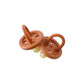 Mellow Monkey eco-friendly natural rubber pacifiers for babies aged 0-6 months with a seamless brown design.