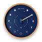 Mellow Monkey navy blue wood marine lunar phase clock with a natural beech frame and white hand, 10-in diameter.