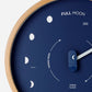 Mellow Monkey navy blue wood marine lunar phase clock with a natural beech frame and white hand. Displays moon phases and "FULL MOON" text.