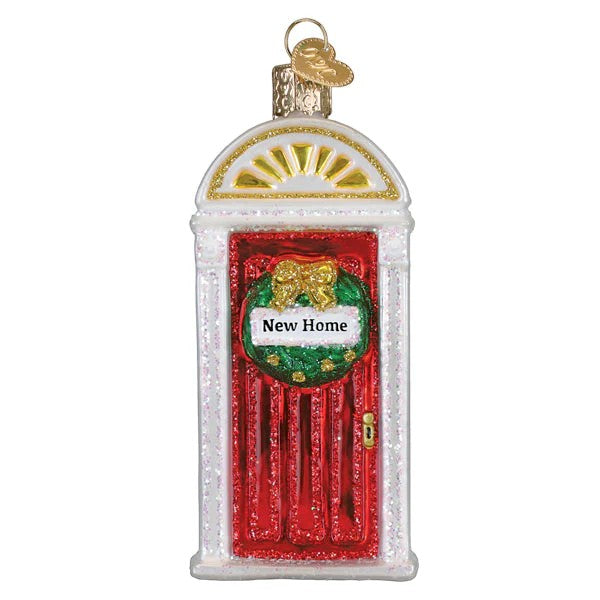 Mellow Monkey New Home blown glass ornament shaped like a red door with a wreath and "New Home" sign. 4.25-in.