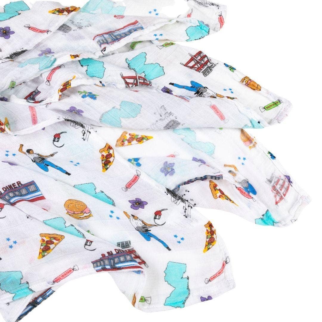 Mellow Monkey New Jersey themed muslin swaddle blanket featuring colorful state icons on soft bamboo cotton fabric.