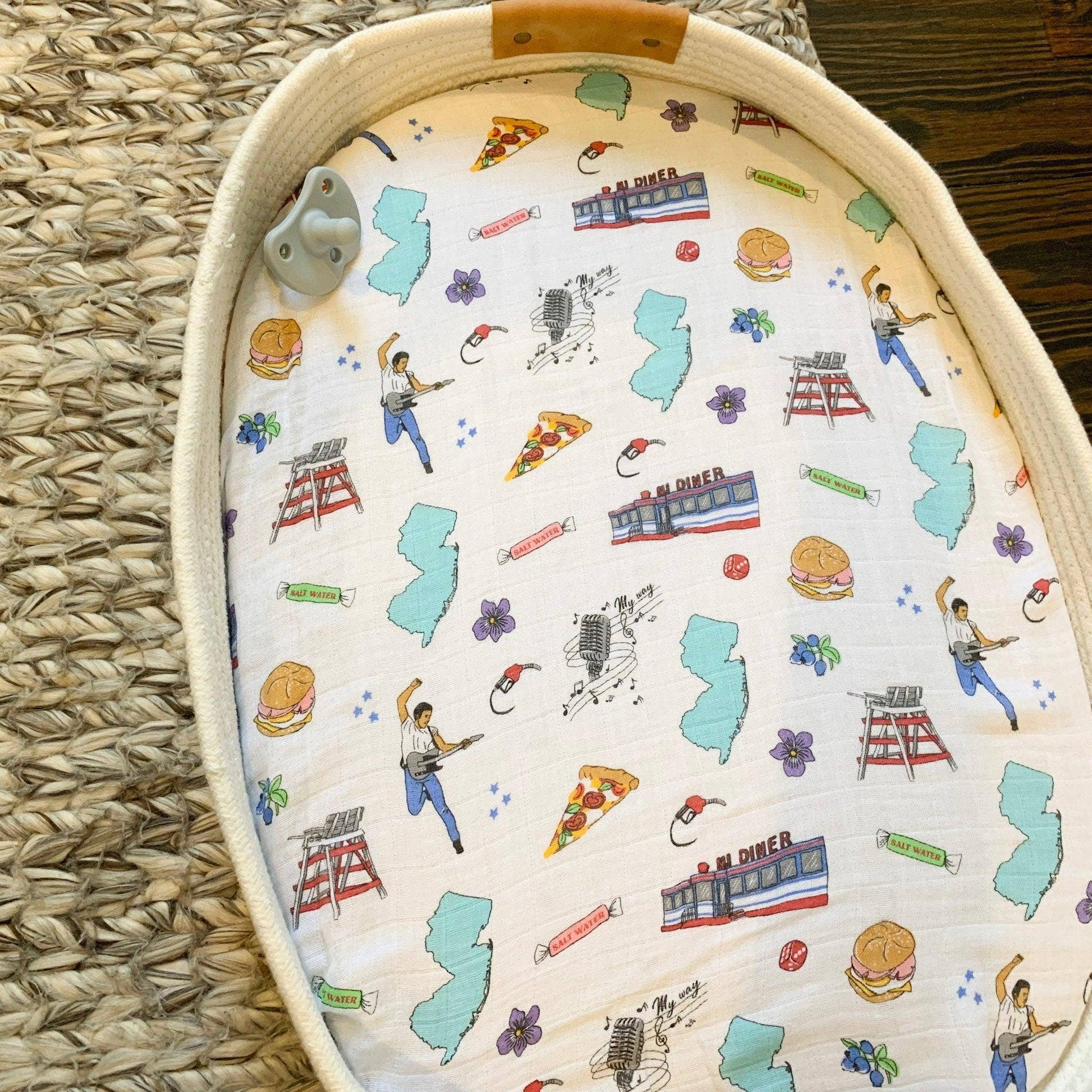 Mellow Monkey New Jersey themed muslin swaddle blanket with diner, beach, and music icons on bamboo cotton blend