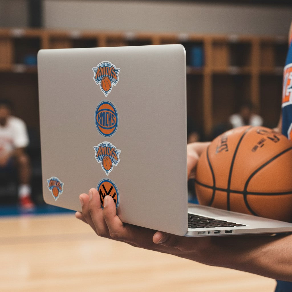 Mellow Monkey New York Knicks quad decal set applied to a silver laptop held by a person with a basketball