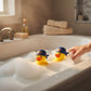 Mellow Monkey NBA New York Knicks rubber ducks wearing blue bandana caps floating in a bubble-filled bathtub