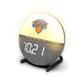 Mellow Monkey New York Knicks sunrise alarm clock with a glowing spherical light and grey fabric base on a stand.