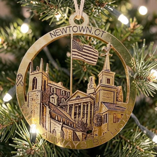 Mellow Monkey wooden Newtown CT ornament featuring local landmarks like the flagpole and town hall on a Christmas tree
