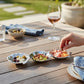 Mellow Monkey OCEAN Shell Triple Dip Tray in silver aluminum, shaped like seashells, holding olives, nuts, and charcuterie.