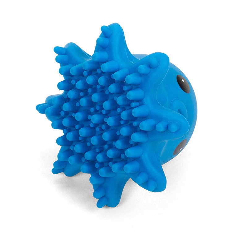Mellow Monkey blue octopus-shaped pet grooming brush with soft massaging bristles for gentle cleaning.