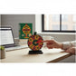 Mellow Monkey Office Answer Wheel desktop figurine with a spinning sarcastic decision wheel on a wooden office desk.