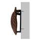 Mellow Monkey oiled bronze scallop shell door knocker mounted on a door, side profile view.