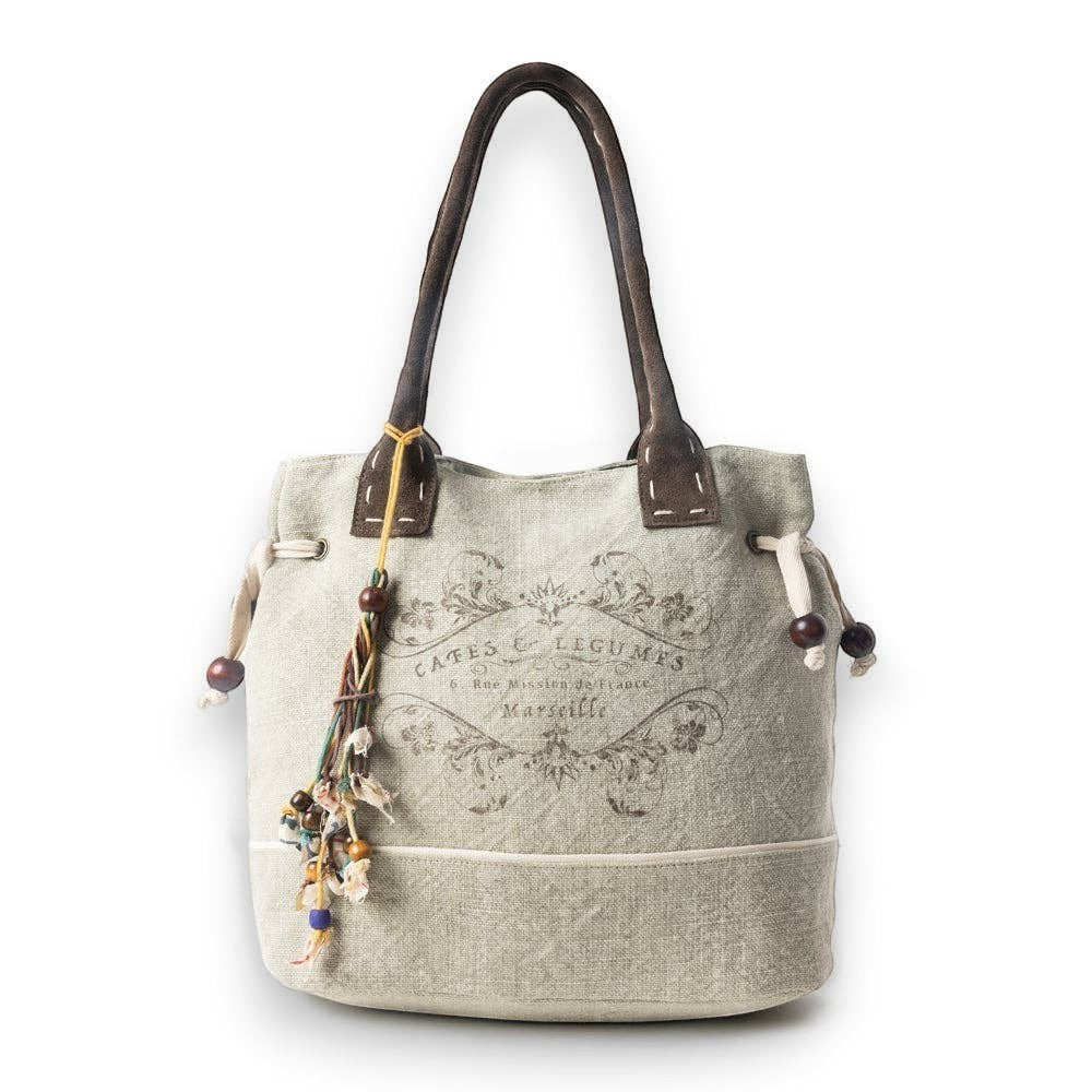 Mellow Monkey Old Soul tote bag in willow ash up-cycled canvas with leather handles and decorative beaded tassels.