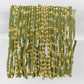 Mellow Monkey olive green seed bead stretch bracelets with 18K gold plated brass accents on a clear display stand.