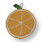 Mellow Monkey hand-crocheted cotton pot holder shaped like a yellow orange slice with a green leaf detail