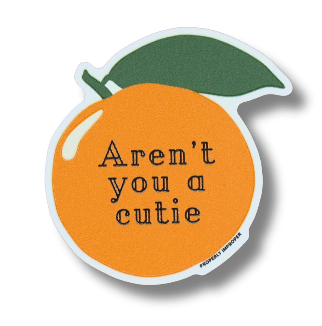 Mellow Monkey orange-shaped waterproof vinyl sticker with a green leaf and the text Aren't you a cutie