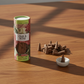 Mellow Monkey oud and rose scented incense cones with a small round ceramic holder on a wooden table.