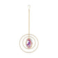 Mellow Monkey oval crystal suncatcher with iridescent stone and gold metallic rings hanging on a delicate chain