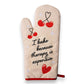 Mellow Monkey cream oven mitt with red cherries and "I bake because therapy is expensive" text. Heat resistant.