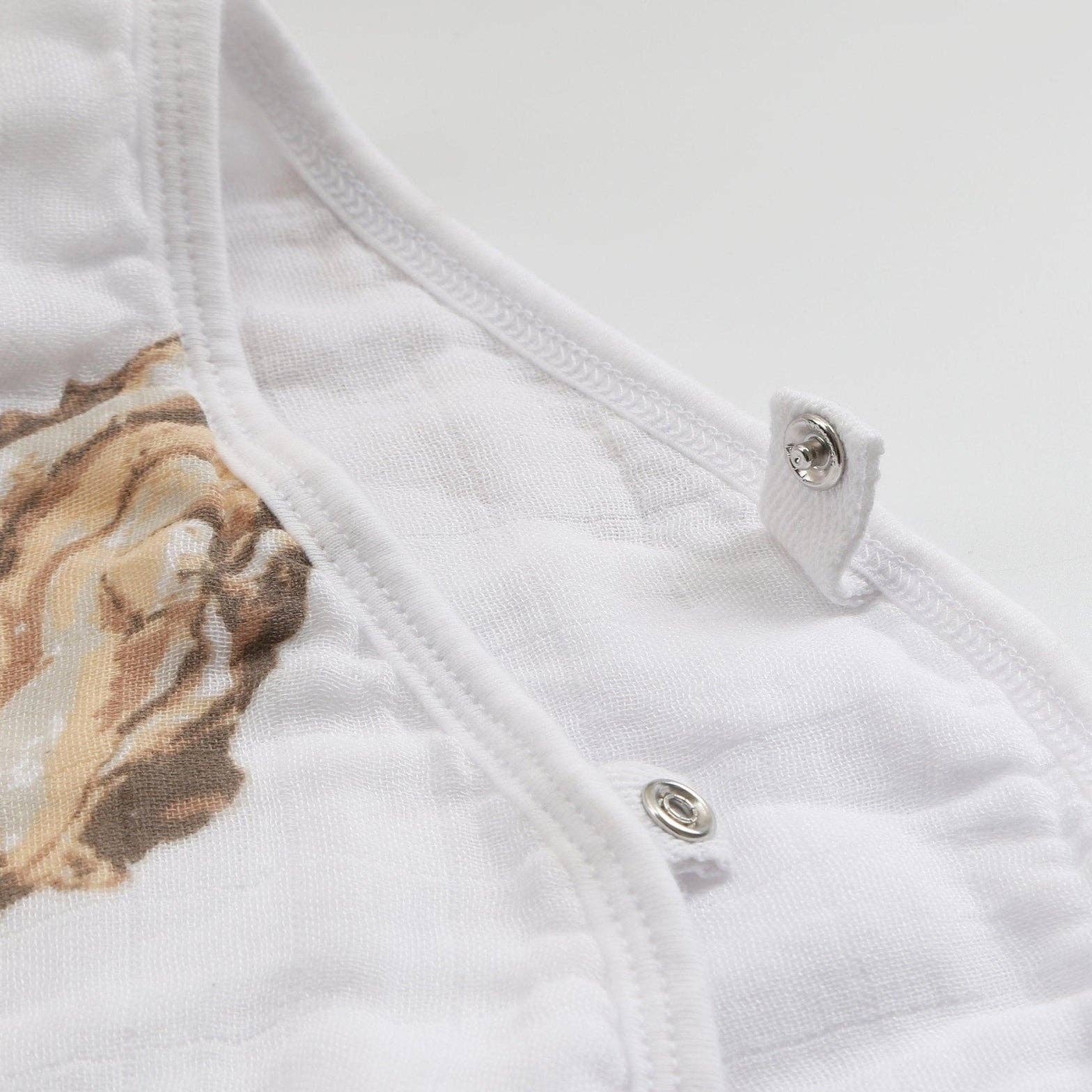 Mellow Monkey 2-in-1 oyster print baby burp cloth and bib made of soft white bamboo and organic cotton muslin