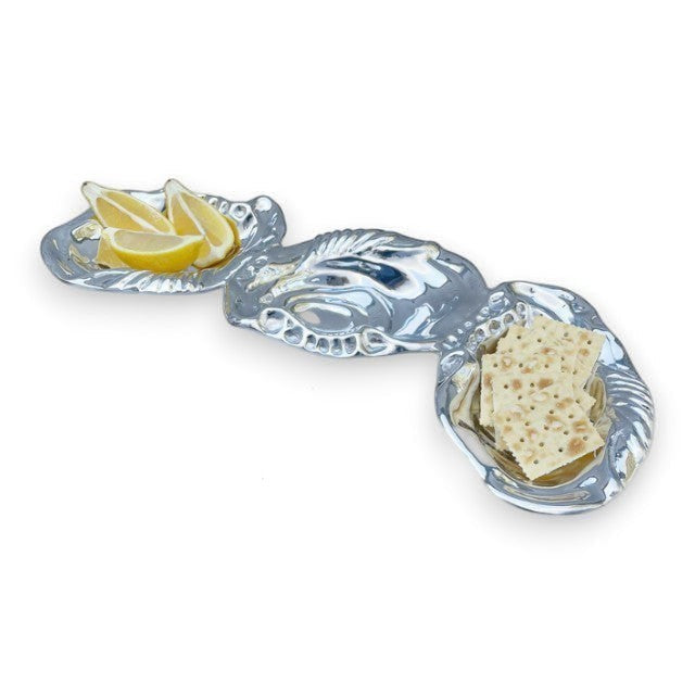Mellow Monkey OCEAN Oyster Triple Dip serving dish in silver aluminum, shaped like three linked oyster shells, holding lemon slices and crackers.