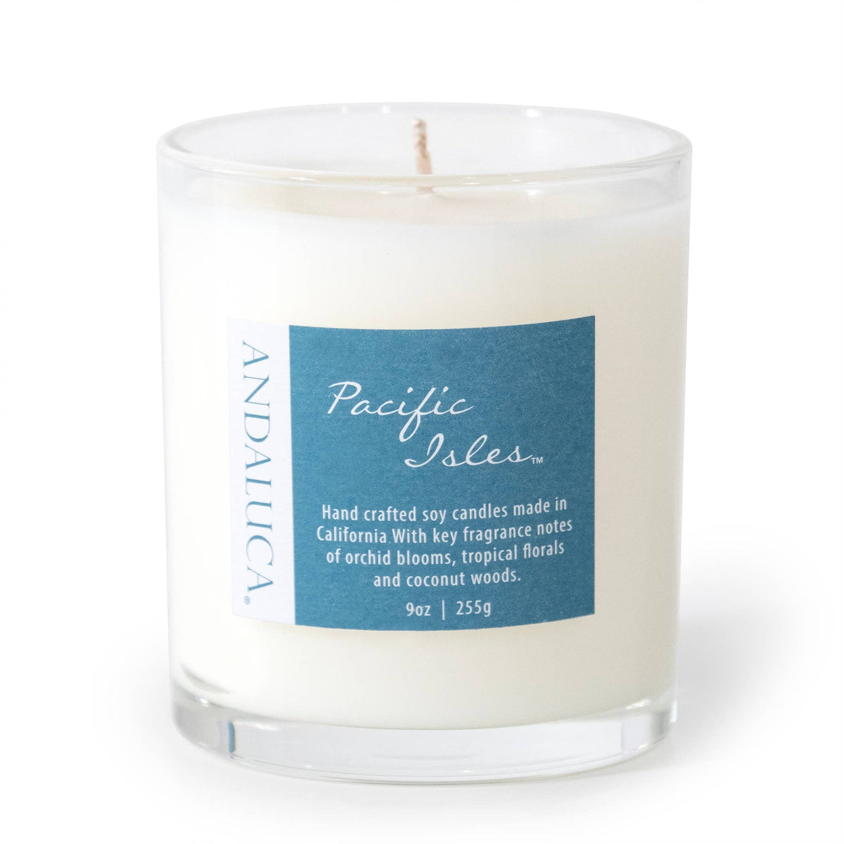 Mellow Monkey Pacific Isles 9-ounce soy blend candle in a clear glass jar with a blue tropical fragrance label