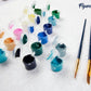 Mellow Monkey paint by numbers kit with numbered acrylic paint pots, three nylon brushes, and a linen canvas.