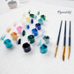 Mellow Monkey paint by numbers kit with numbered acrylic paint pots, three nylon brushes, and a linen canvas.