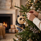 Mellow Monkey 4-inch panda bear bottle brush Christmas ornament hanging on a festive holiday tree