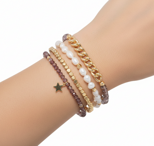 Mellow Monkey bracelet stack featuring baroque freshwater pearls, plum crystal beads, and a 14K gold-plated star charm.