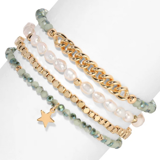 Mellow Monkey bracelet stack featuring freshwater baroque pearls, sage green crystals, and 14K gold-plated star charm.