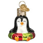 Mellow Monkey Mini Penguin Old World Christmas blown glass holiday ornament, black and white with red and green festive base.