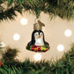 Mellow Monkey Mini Penguin Old World Christmas blown glass holiday ornament, black and white with a festive wreath.