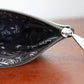 Mellow Monkey Penn State University zip pouch featuring a black textile lining with custom catstudio zipper pull