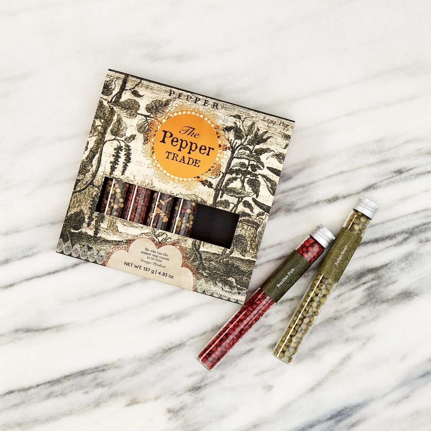 Mellow Monkey The Pepper Trade gourmet peppercorn gift set in glass tubes. Includes Brazilian Pink and Indian Green peppercorns.