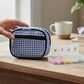 Mellow Monkey blue and white gingham zippered pill and vitamin case with 8 compartments and front pocket.