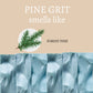 Mellow Monkey Pine Grit exfoliating bar soap with a blue textured surface and a forest pine branch illustration.