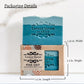 Mellow Monkey Pine Grit exfoliating handmade soap bar in a recyclable kraft box with a window showing blue soap.