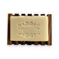 Mellow Monkey natural pine wood soap dish with self-draining slats holding a bar of soap.