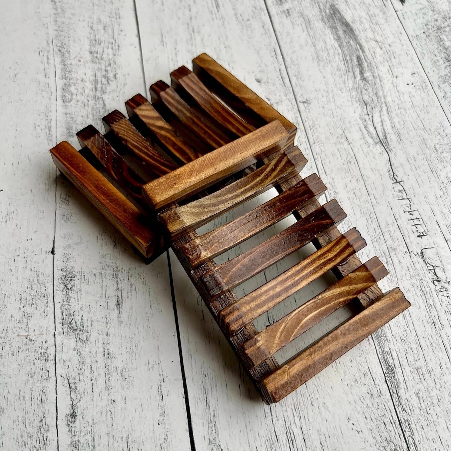 Mellow Monkey natural pine wood soap dish with self-draining slats. Dark wood finish.