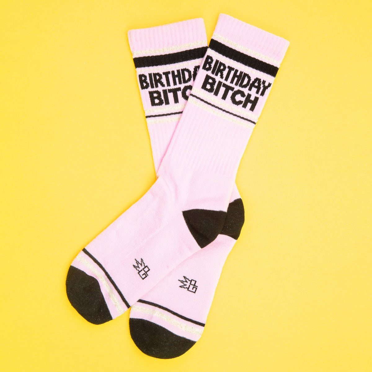 Mellow Monkey pink mid-calf gym crew socks with black Birthday Bitch text and black heel and toe accents