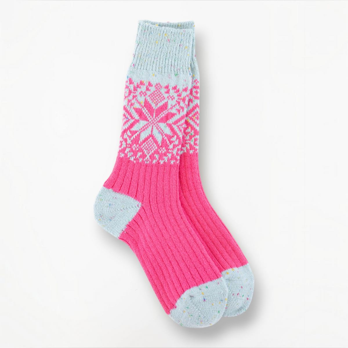Mellow Monkey pink and blue confetti holiday crew socks with a festive snowflake pattern and ribbed knit texture.